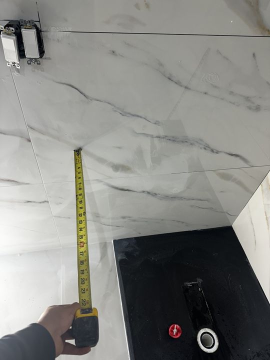 Wall tile going up.