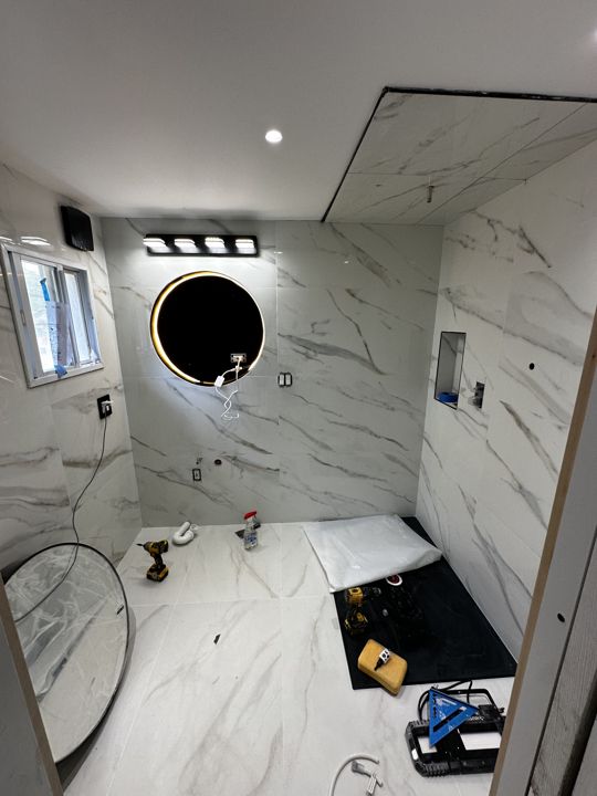 Vanity, mirror and lighting installed.