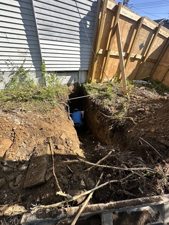 Test pit dug for the geotechnical investigation.