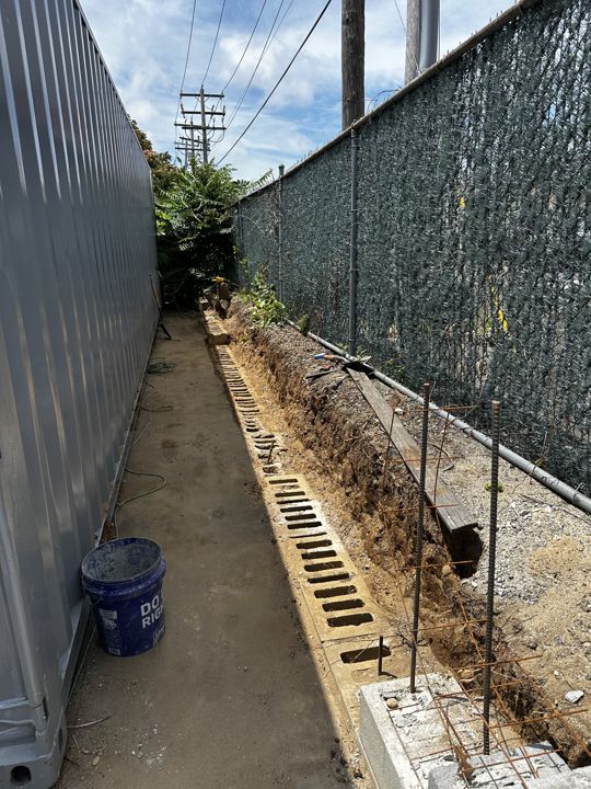Footing trench excavated along the fence line.
