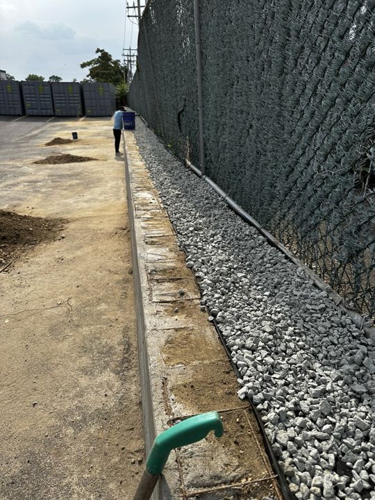 Gravel backfill and drainage behind the finished wall.