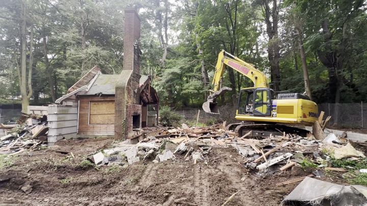 Excavator taking down the structure.