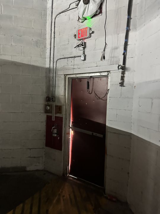 The damaged exit door before replacement.