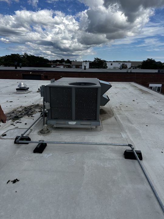 Rooftop unit curb patched and sealed.